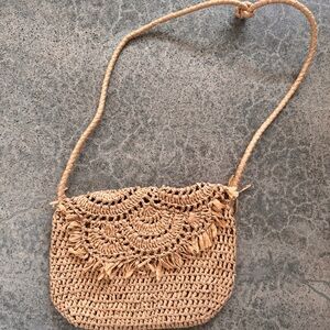 Vintage raffia woven purse with tan fabric lining and zipper closure